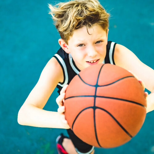 Kid playing basketball
