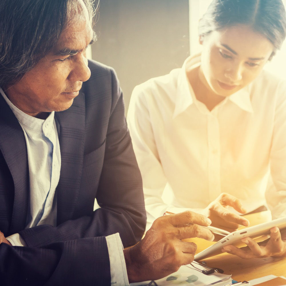 Business People looking at Tablet
